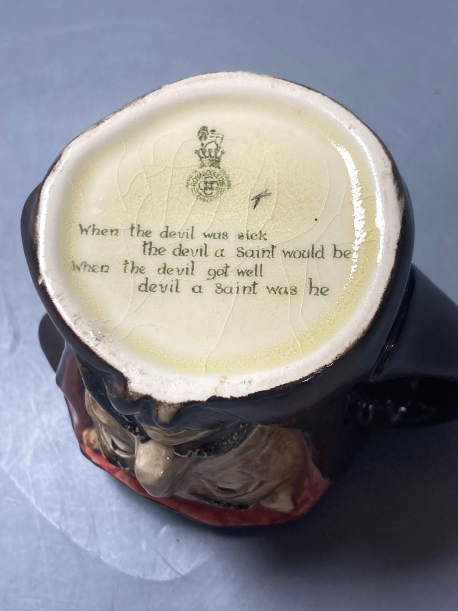 A Royal Doulton Mephistopheles medium character jug, marked on bottom When the devil was sick, the devil a saint would be, when the de